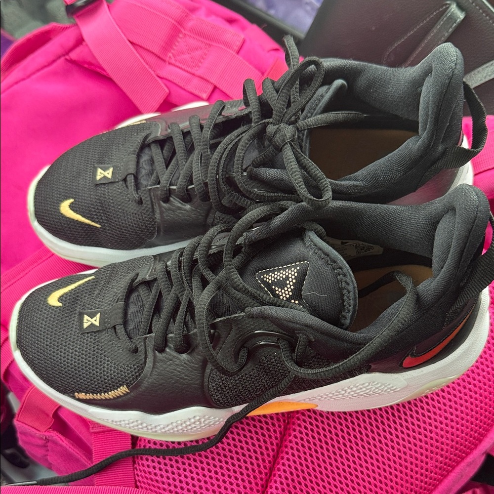 Nike Black Sneakers with Pink and Gold Accents